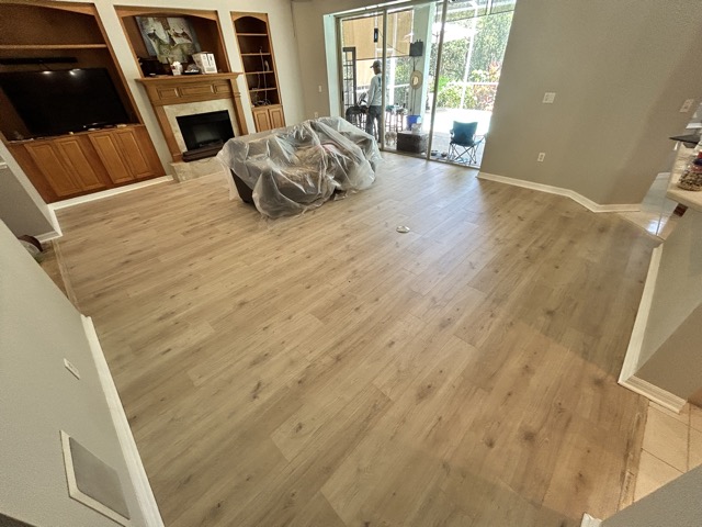 Living Room After Paint and Vinyl Plank