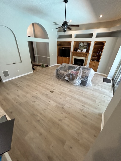 Living Room After Paint and Vinyl Plank