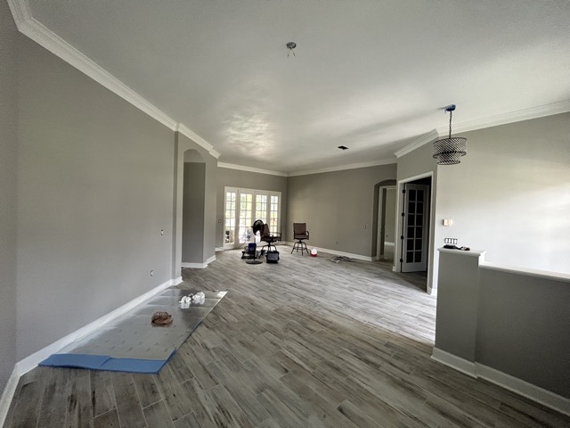 Living Room After Ceiling, Trim, and Wall Paint 