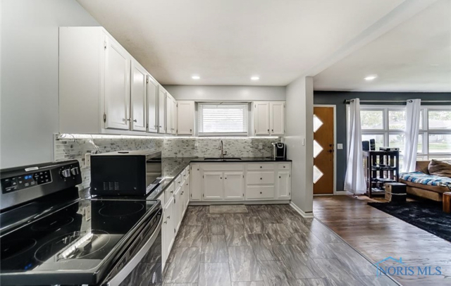 After Backsplash, Flooring, and Cabinet Painting 